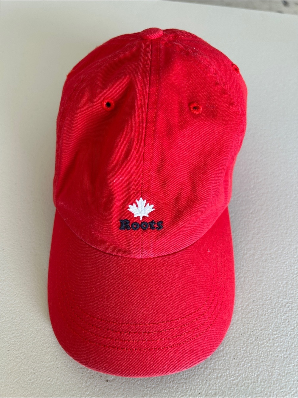Roots Red Cap with White Maple Emblem